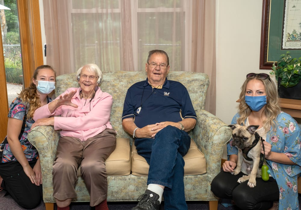 Residents and staff smiling for a photo at Wellington Place at Whiting in Stevens Point, Wisconsin