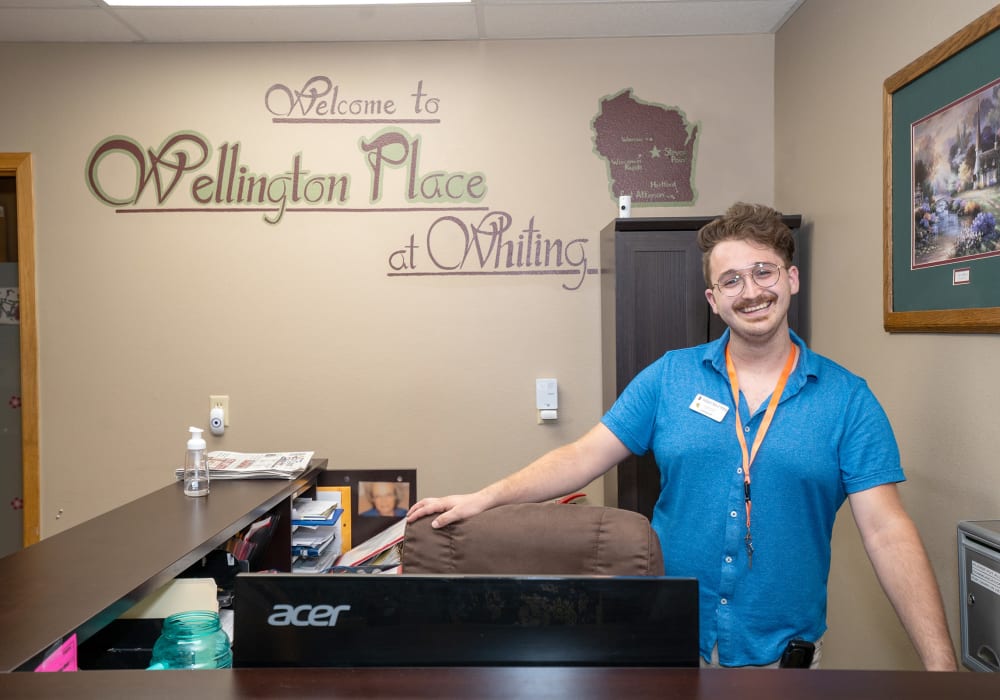 Staff member at the front desk at Wellington Place at Whiting in Stevens Point, Wisconsin