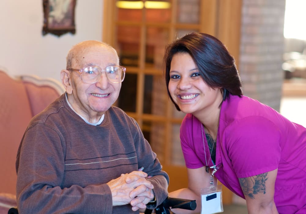 Resident smiling and staff member smiling for a photo at Wellington Meadows in Fort Atkinson, Wisconsin