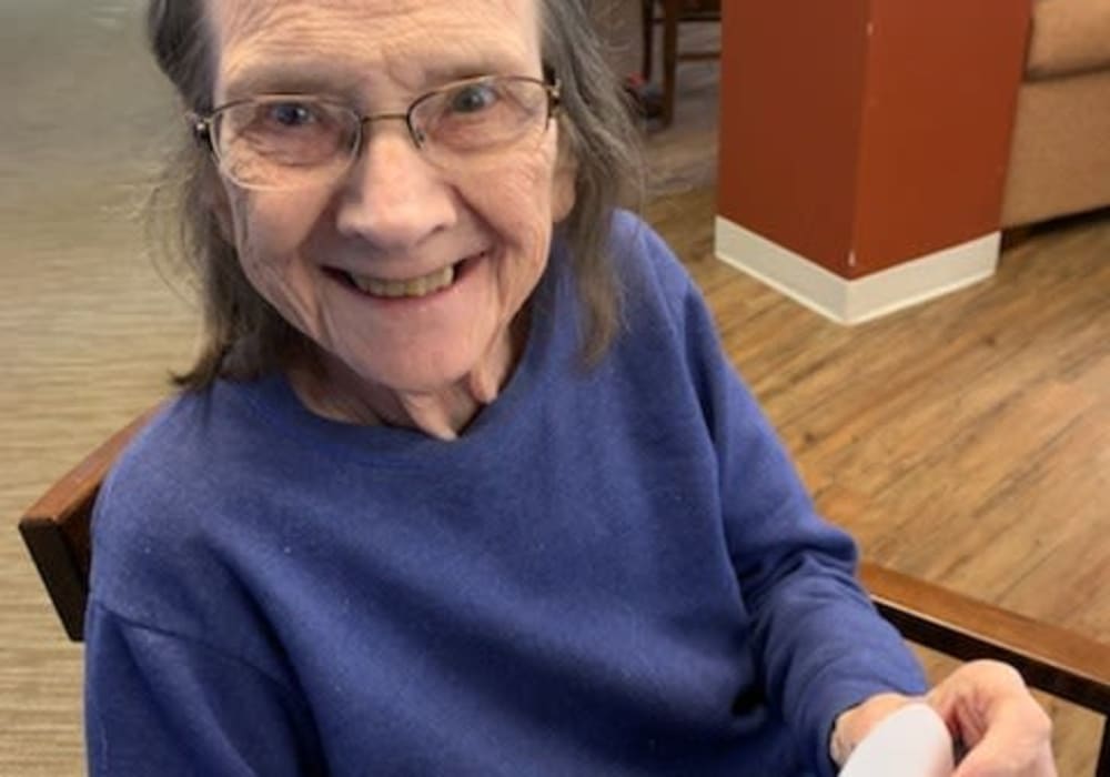 Resident smiling for a photo at Villas At Maple Ridge in Spooner, Wisconsin