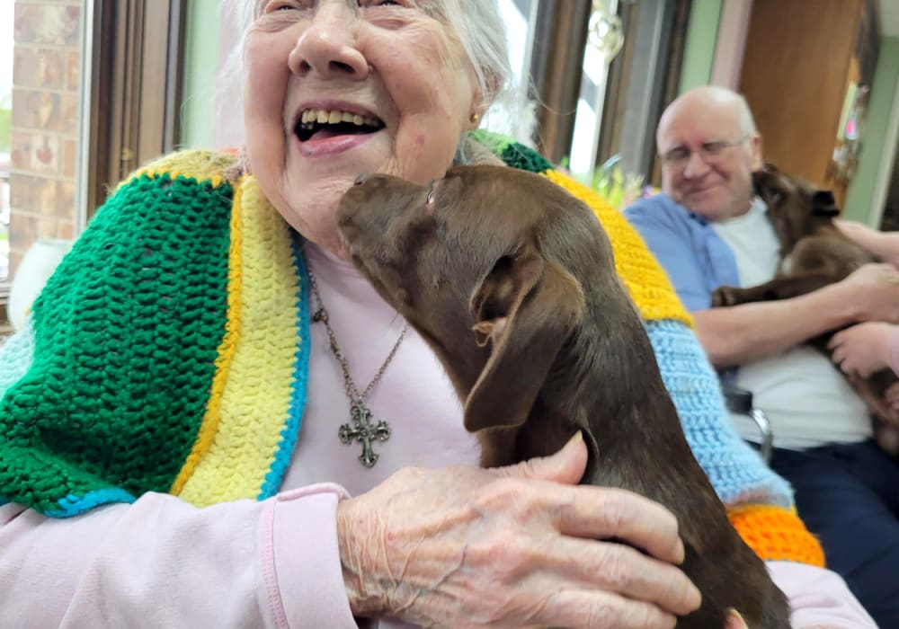 Residents cuddling puppies at Ingleside Communities in Mount Horeb, Wisconsin