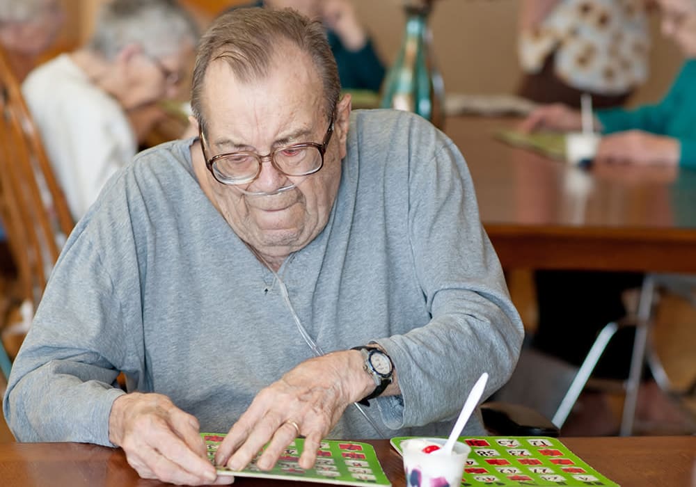 Resident playing bingo at Wellington Place at Rib Mountain in Wausau, Wisconsin