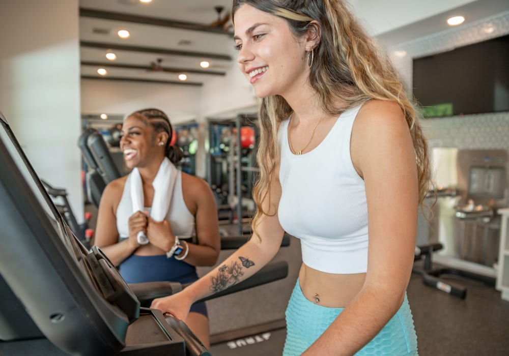 Resident using a treadmill at Ivy Row at South in Mobile, Alabama