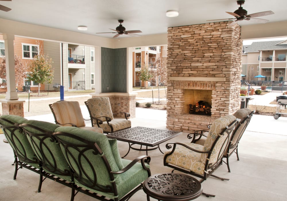 Fireside seating on the patio near the pool at Mariposa at Bay Colony in Dickinson, Texas