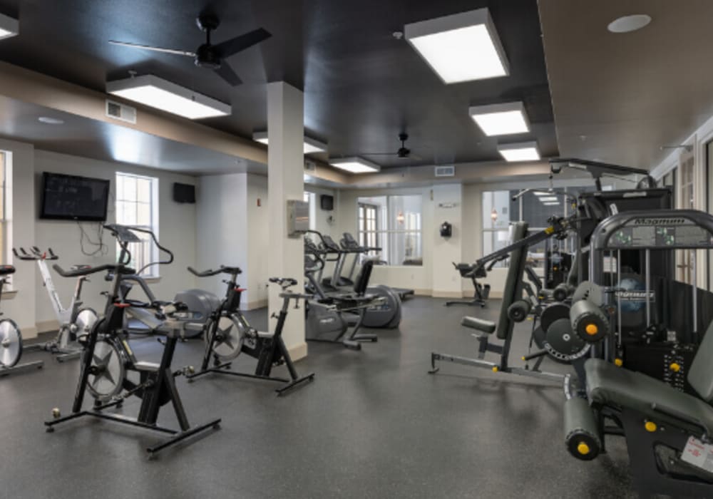 Fitness studio with treadmills and weight machines at Heights on Katy in Houston, Texas, 