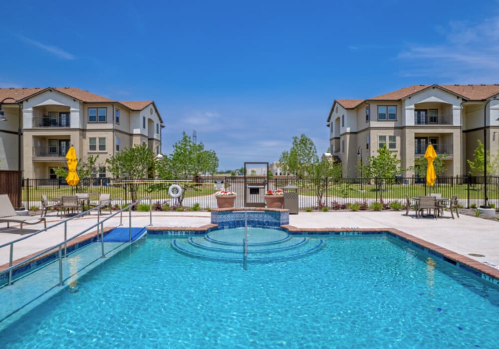 The resort-style community pool at Mariposa at Clear Creek in Webster, Texas