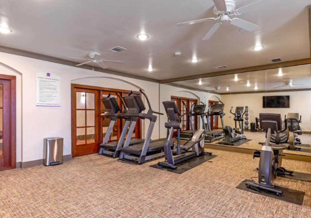 Exercise equipment in the fitness center at Mariposa at Clear Creek in Webster, Texas