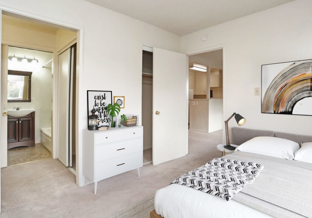 Bedroom with luxurious bed at Coronado Apartments in Fremont, California
