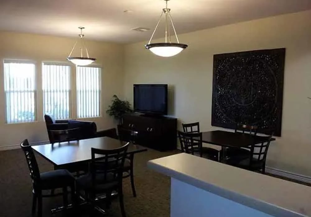 Community room with TV at Santa Fe Apartments in Bakersfield, California