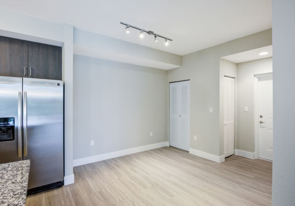 Apartment with hardwood flooring and stainless-steel fridge at Shalimar at Davie in Davie, Florida