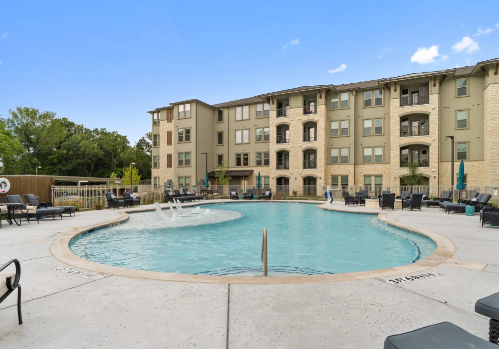 Swimming pool with seating at The Preserve at Willow Park in Willow Park, Texas