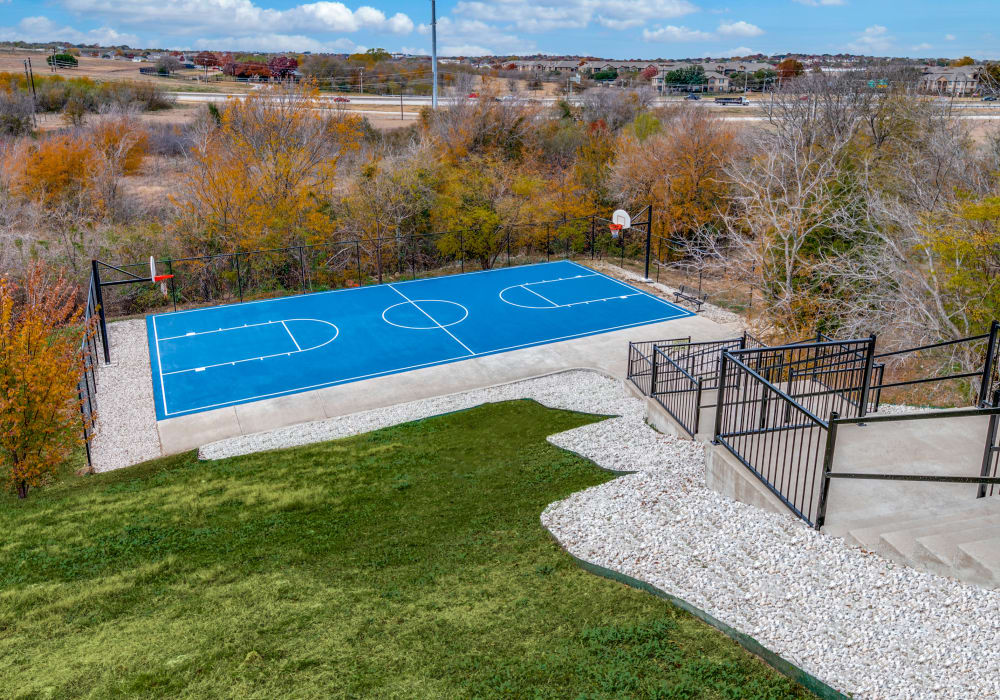 Modern basketball court at Remi Apartment Homes in White Settlement, Texas