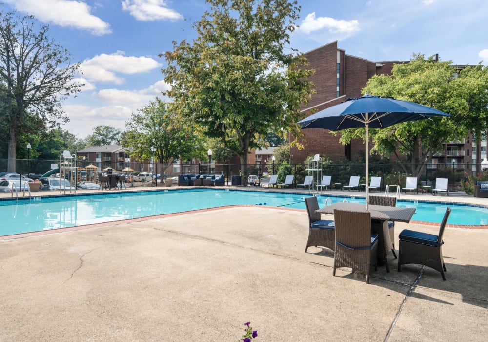 Swimming pool with table at Columbia Pointe in Columbia, Maryland