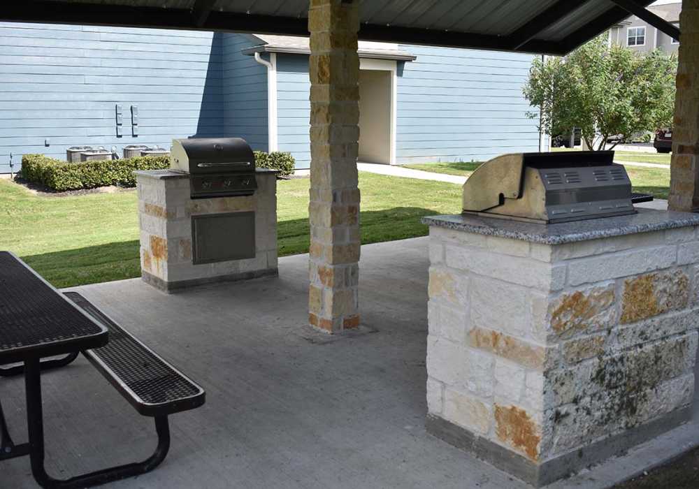 Grills by the pool at Oak Forest in Victoria, Texas