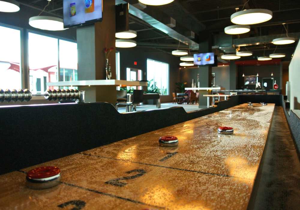 Shuffleboard table at The Marke Apartment Homes in Santa Ana, 