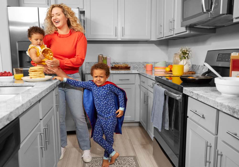 Mom and kids in the kitchen at BB Living Wellen Park in Venice, Florida