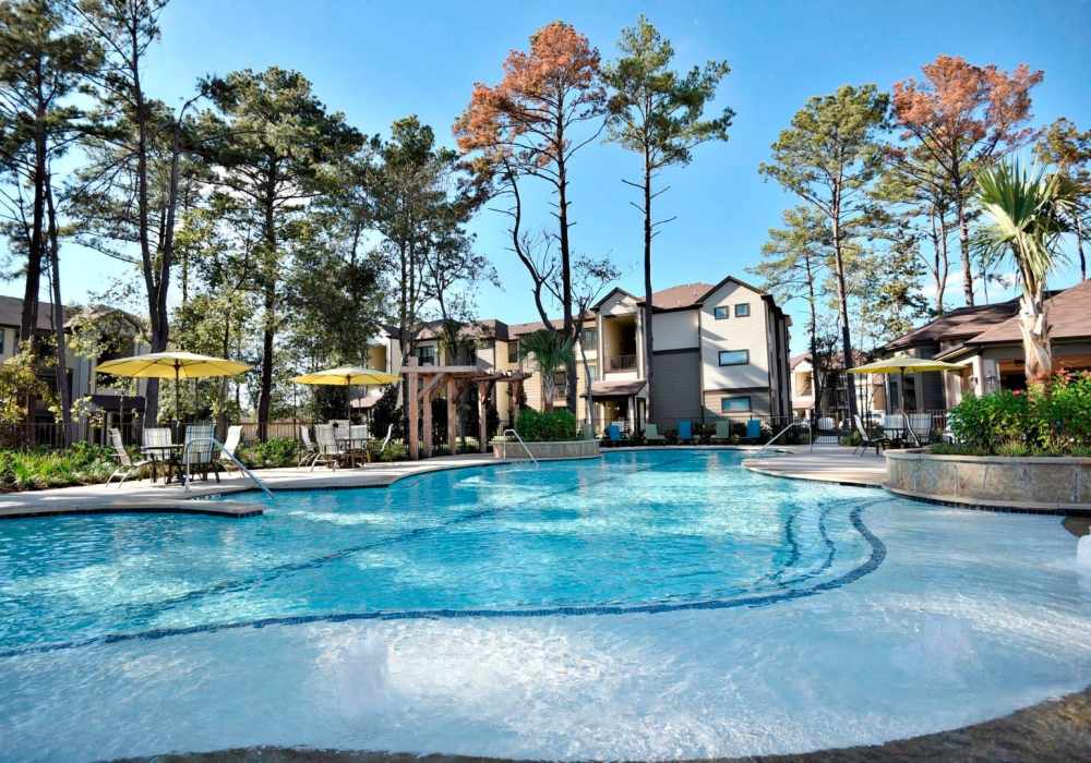 The sparkling swimming pool at The Pines at Woodcreek in Humble, Texas