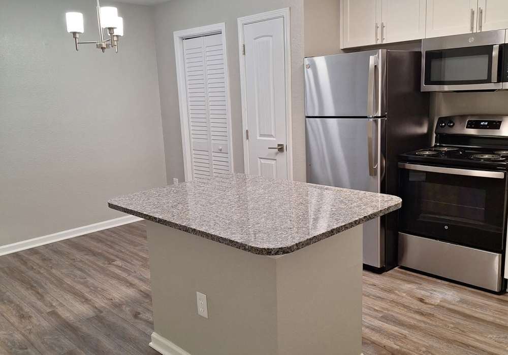 Modern kitchen with ample storage island, stainless appliances, pantry at River Landing in Myrtle Beach, South Carolina