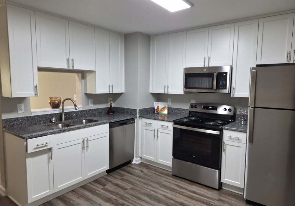 Fully-equipped kitchen with oven, stove, refrigerator, and microwave at River Landing in Myrtle Beach, South Carolina