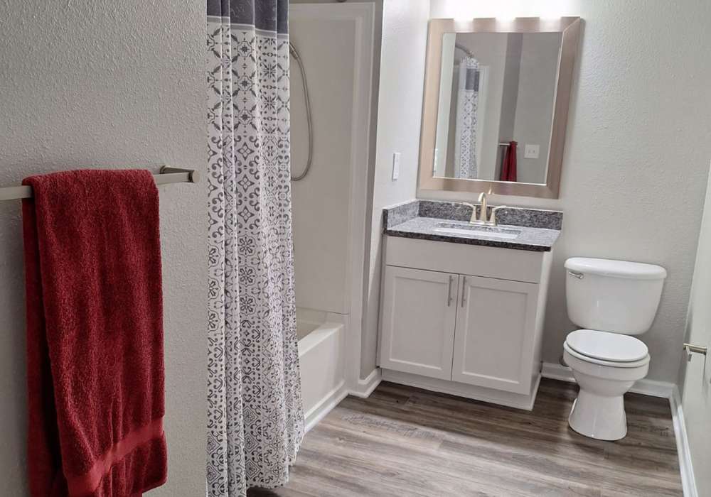 Primary bathroom with upgraded fixtures and ample storage at River Landing in Myrtle Beach, South Carolina