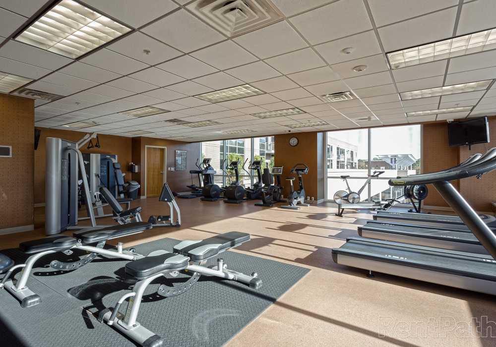 Weightlifting equipment in the fitness center at Environs Lofts at East 54 in Chapel Hill, North Carolina
