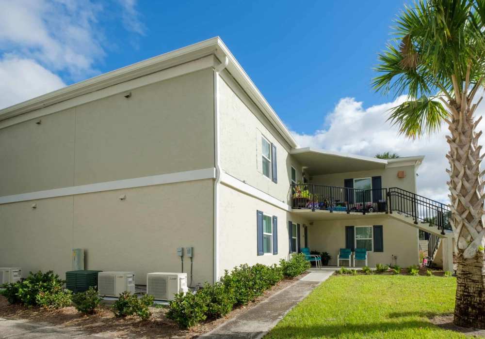 Exterior of building with well-maintained lawn at Wayne Densch Center in Orlando, Florida