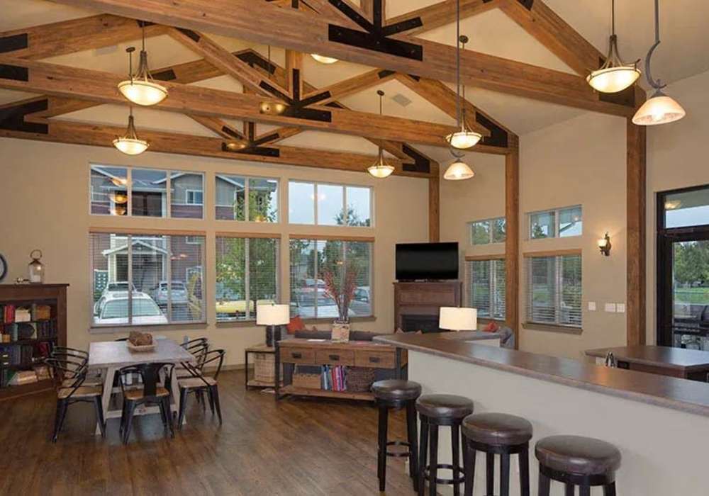 An entertainment area and bar seating in the clubhouse at Copper Lane in Vancouver, Washington