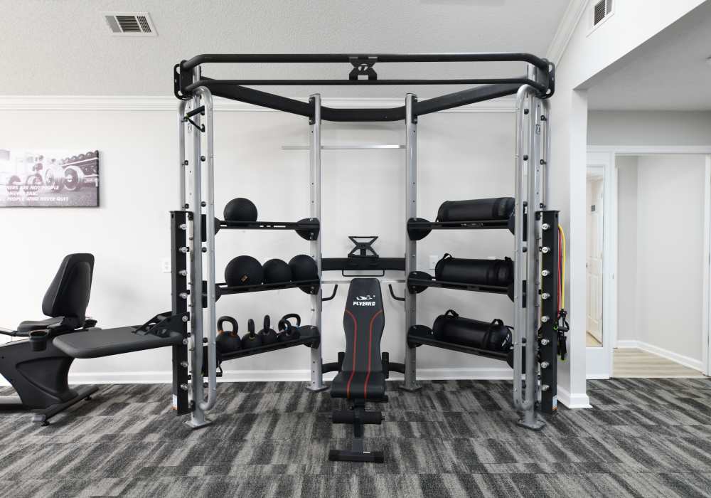 Weightlifting equipment in the fitness center at Ascent Apartment Homes in Asheville, North Carolina