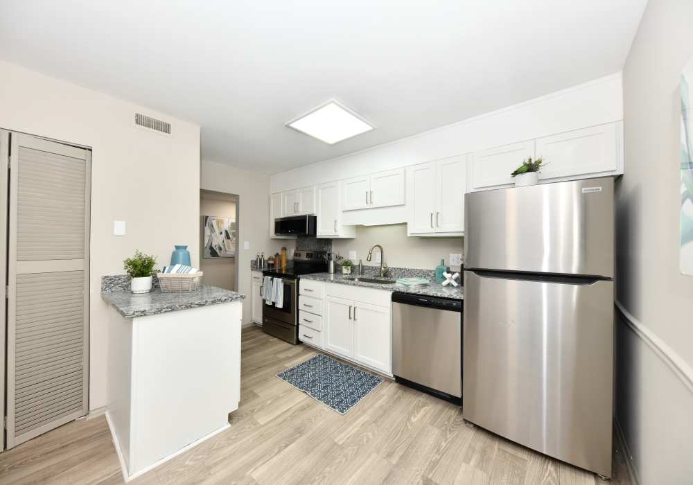 Wood flooring in an apartment kitchen at Ascent Apartment Homes in Asheville, North Carolina