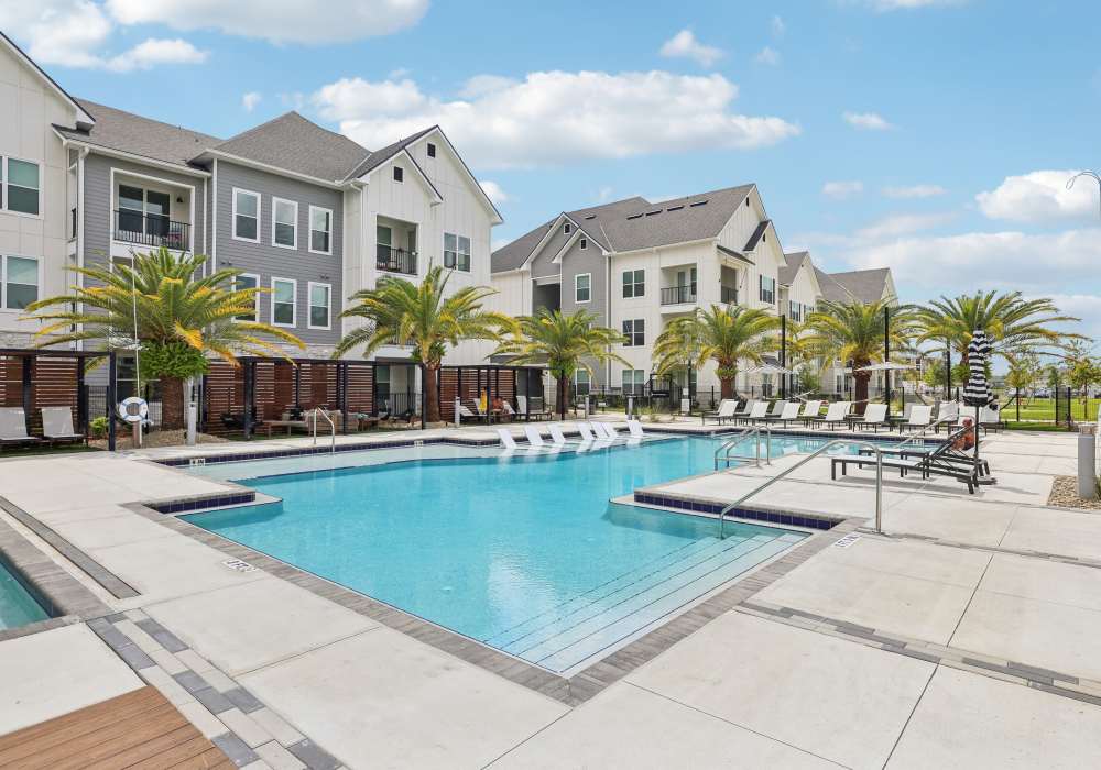 Sitting area around the swimming pool at The Southerly at Orange City in Orange City, Florida