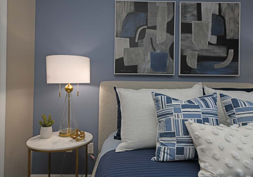 Cozy bed in a bedroom at Nova at Biltmore Park in Arden, North Carolina