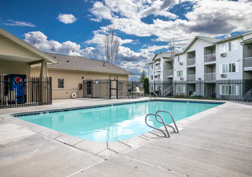 A picturesque pool area at Heron Creek Apartments in Moses Lake, Washington