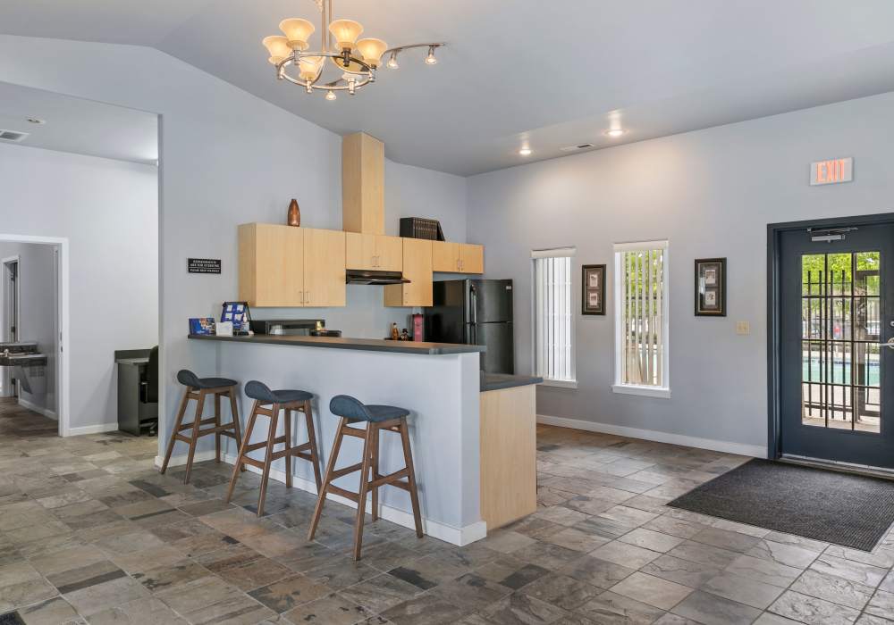 A contemporary kitchen with essential appliances at Heron Creek Apartments in Moses Lake, Washington