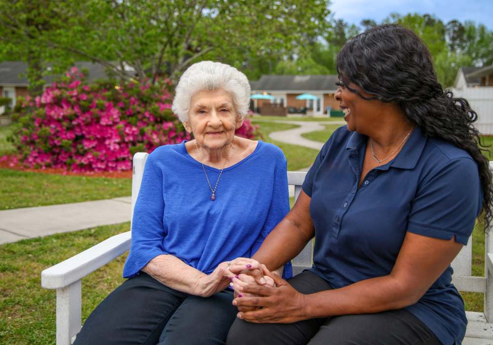 Resident and staff member at Merrill Gardens at Barkley Place in Fort Myers, Florida