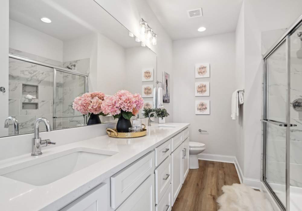 Bathroom with vanity mirror at Crossings At NoDa in Charlotte, North Carolina 