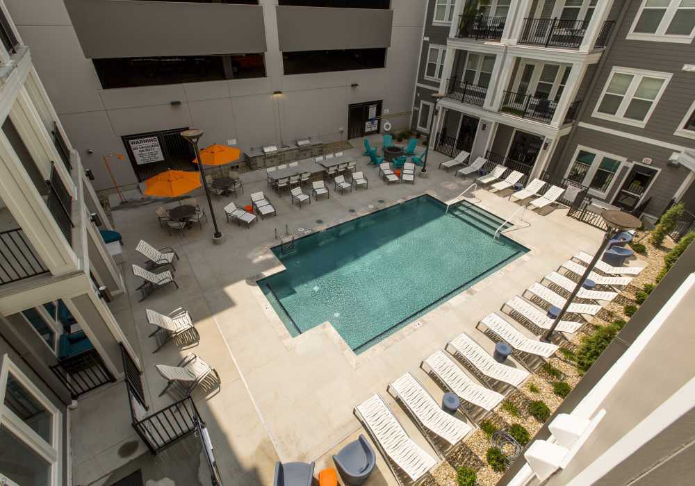 Swimming pool lots of seating space at Altair At The Heights in Richmond Heights, Missouri