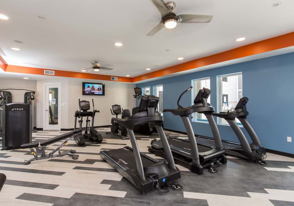 Fitness center with two ceiling fans at Altair At The Heights in Richmond Heights, Missouri