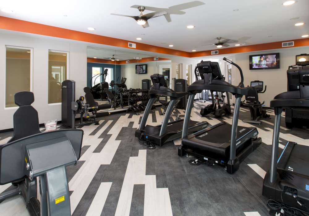 Fitness center with ceiling fan at Altair At The Heights in Richmond Heights, Missouri