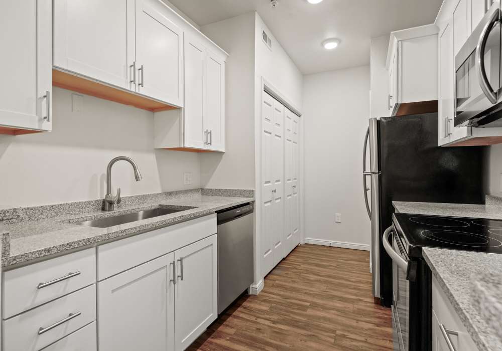 Kitchen with refrigerator at Irving Schoolhouse Apartments in Salt Lake City, Utah