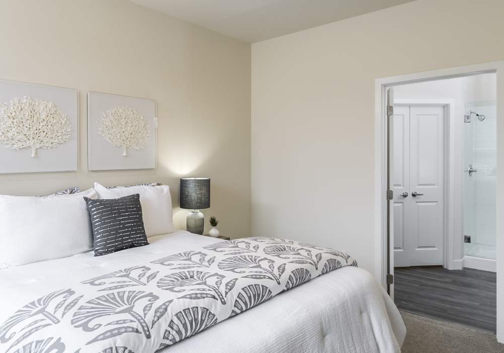 Bedroom with wall arts at Altair At The Preserve in O'Fallon, Missouri