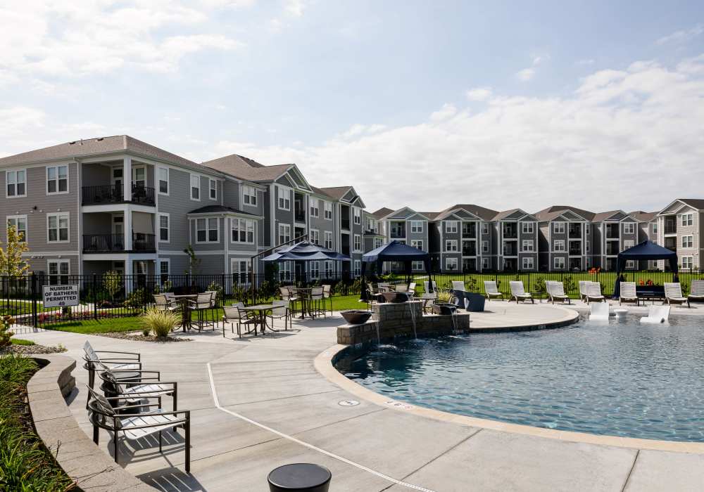 Exterior view of the building with pool at Altair At The Preserve in O'Fallon, Missouri