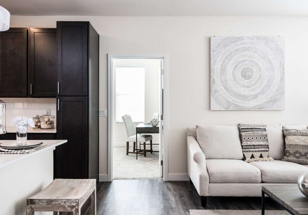 Living room with hardwood flooring at Altair At The Preserve in O'Fallon, Missouri 
