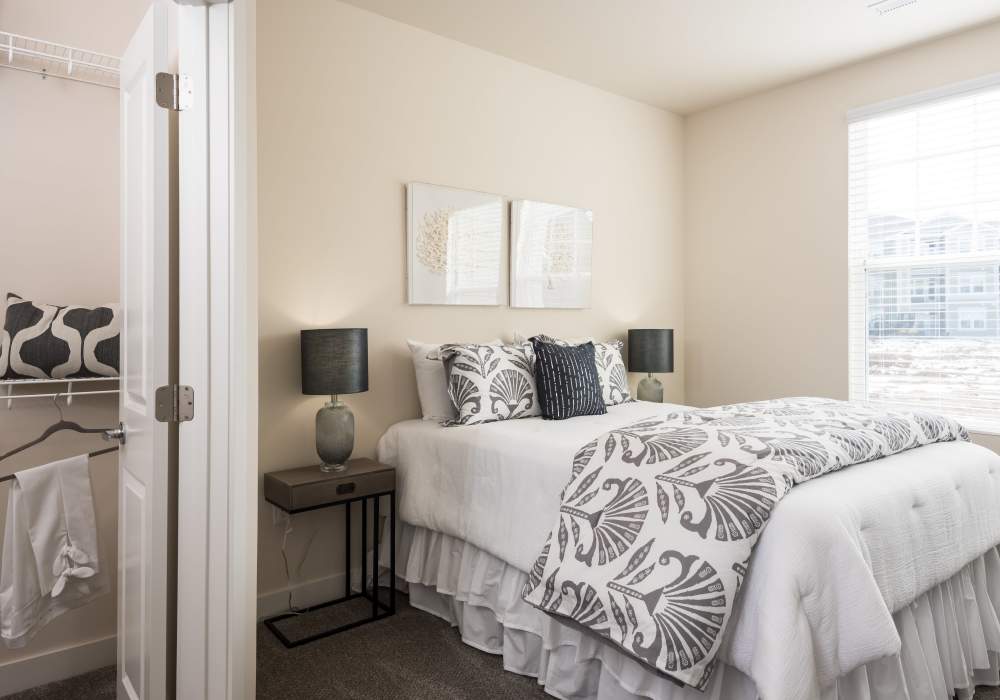 Bedroom with walk-in closet at Altair At The Preserve in O'Fallon, Missouri