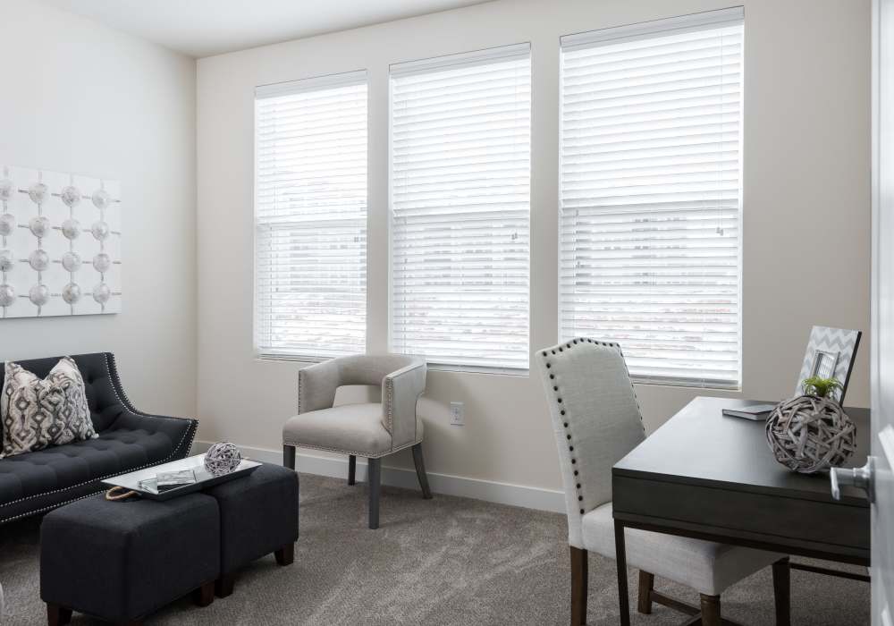 Living room with carpet flooring at Altair At The Preserve in O'Fallon, Missouri