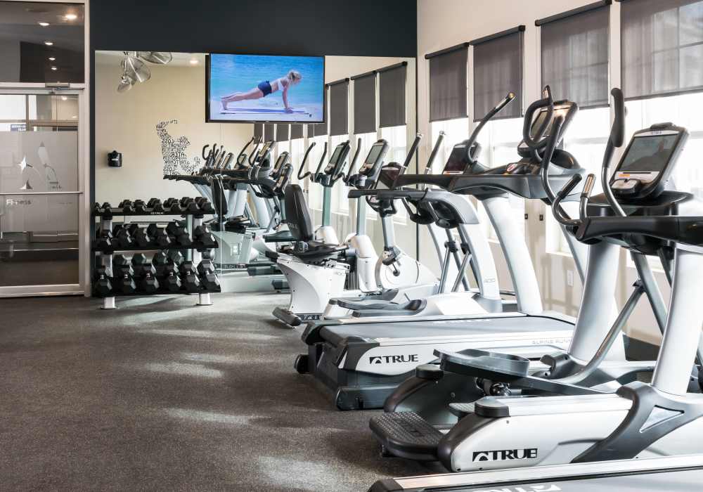 Treadmill in fitness center at Altair At The Preserve in O'Fallon, Missouri