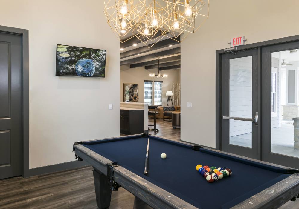 Game room with wood flooring at Altair At The Preserve in O'Fallon, Missouri