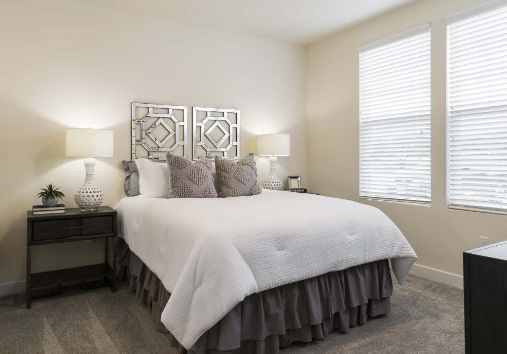  Spacious bedroom with large comfortable bed and  window at Altair At The Preserve in O'Fallon, Missouri