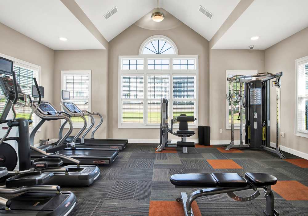 Fitness-center with carpet flooring at The Crossings At Milestone in Pensacola, Florida