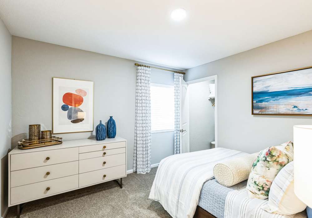 Cozy furnished bedroom at Hidden Creek Village in Fayetteville, North Carolina