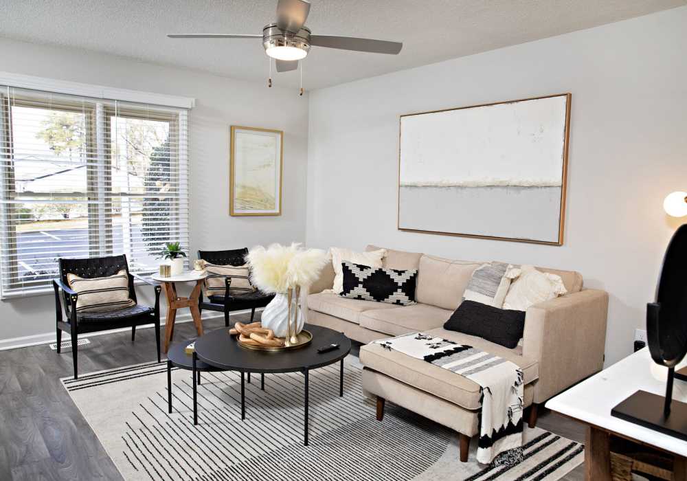 Bright living room with large windows at Edge at Concord in Concord, North Carolina, 